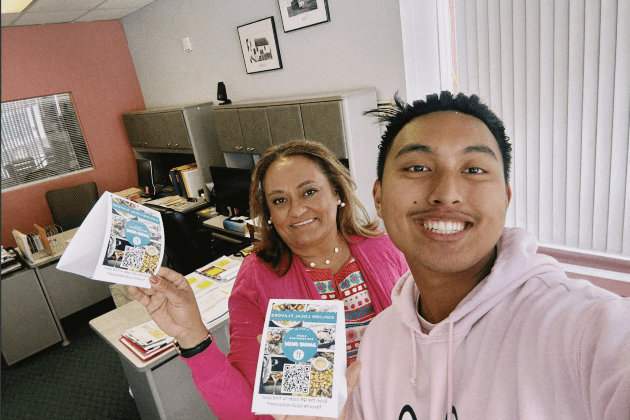Accelerate scholars take a selfie with their project flyers